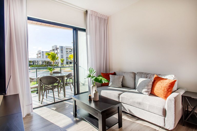 1BR primer nivel, piscina, gym y playa artificial