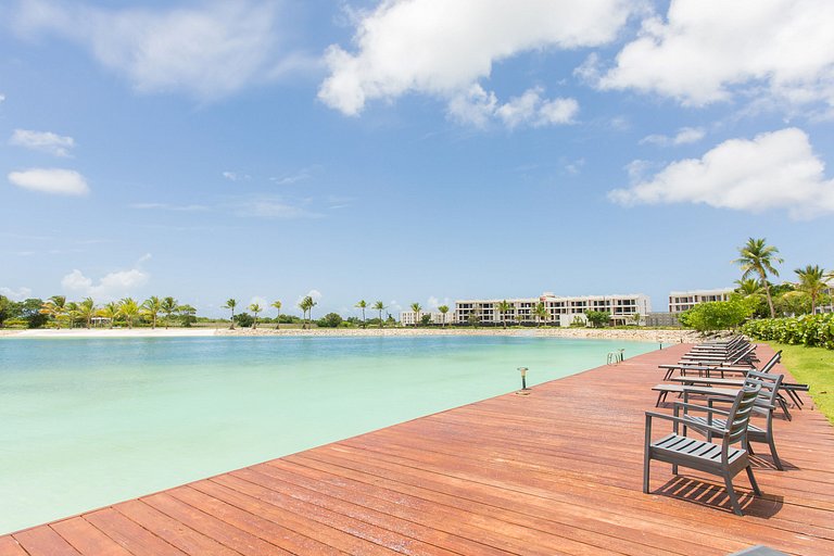 1BR primer nivel, piscina, gym y playa artificial