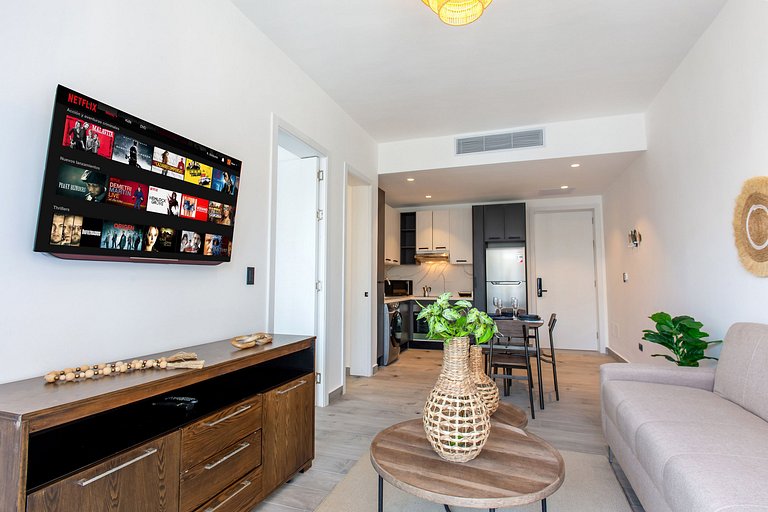 1BR moderno, piscinas, gimnasio y playa artificial