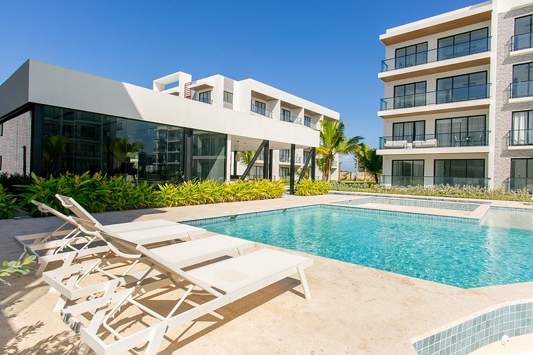 1BR moderno, piscinas, gimnasio y playa artificial